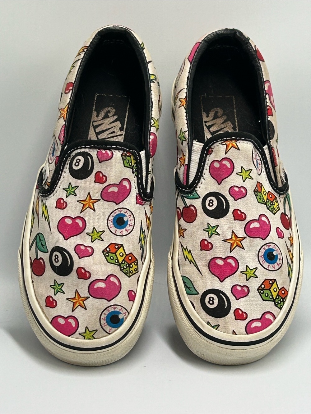 Vans Tatoo Slip-On Sneakers in Pink Multi Icon Print